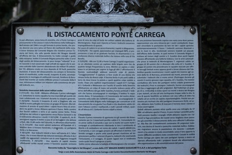 Lapide commemorativa della Brigata Guglielmetti, simbolo di memoria storica e resistenza.