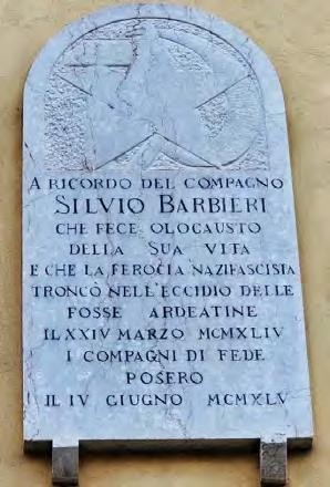 Lapide commemorativa in marmo dedicata a Silvio Barbieri, con simboli e lettering distintivi.