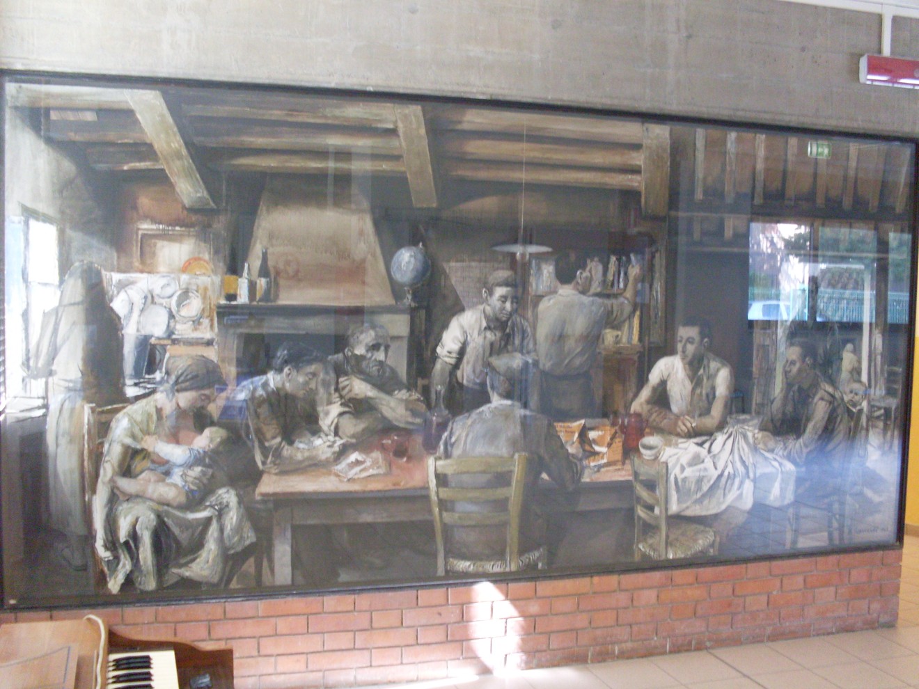 Murale che ritrae la famiglia Cervi in un ambiente contadino, simbolo di storia e resistenza.